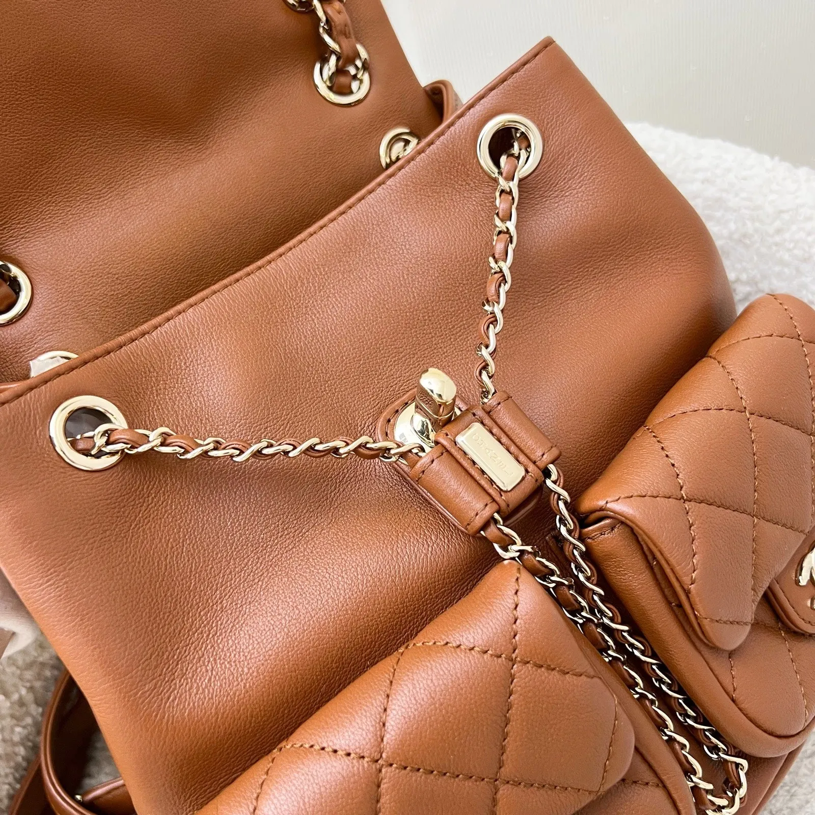 Chanel Medium Triple Backpack in 23A Cognac Brown Calfskin and LGHW (Model: AS3860)