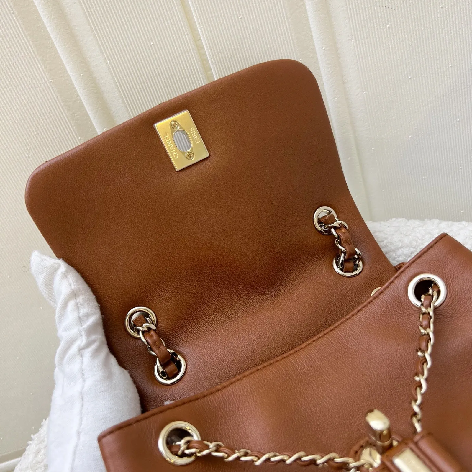 Chanel Medium Triple Backpack in 23A Cognac Brown Calfskin and LGHW (Model: AS3860)