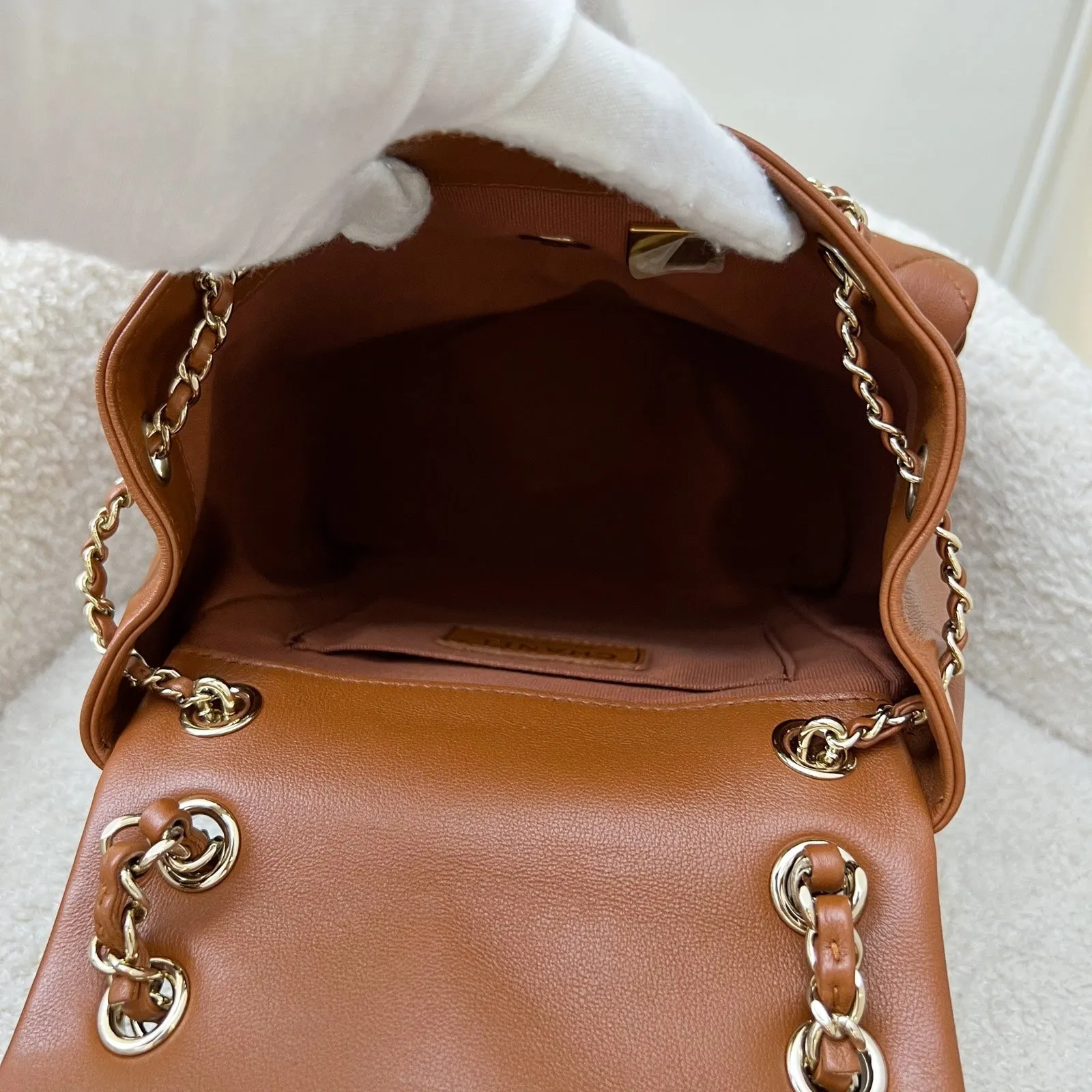 Chanel Medium Triple Backpack in 23A Cognac Brown Calfskin and LGHW (Model: AS3860)