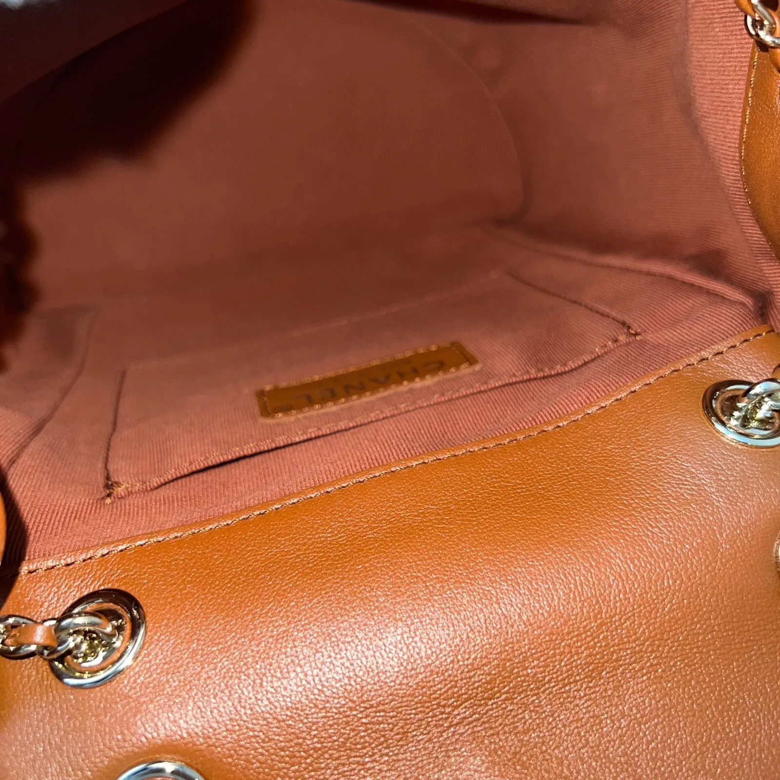 Chanel Medium Triple Backpack in 23A Cognac Brown Calfskin and LGHW (Model: AS3860)