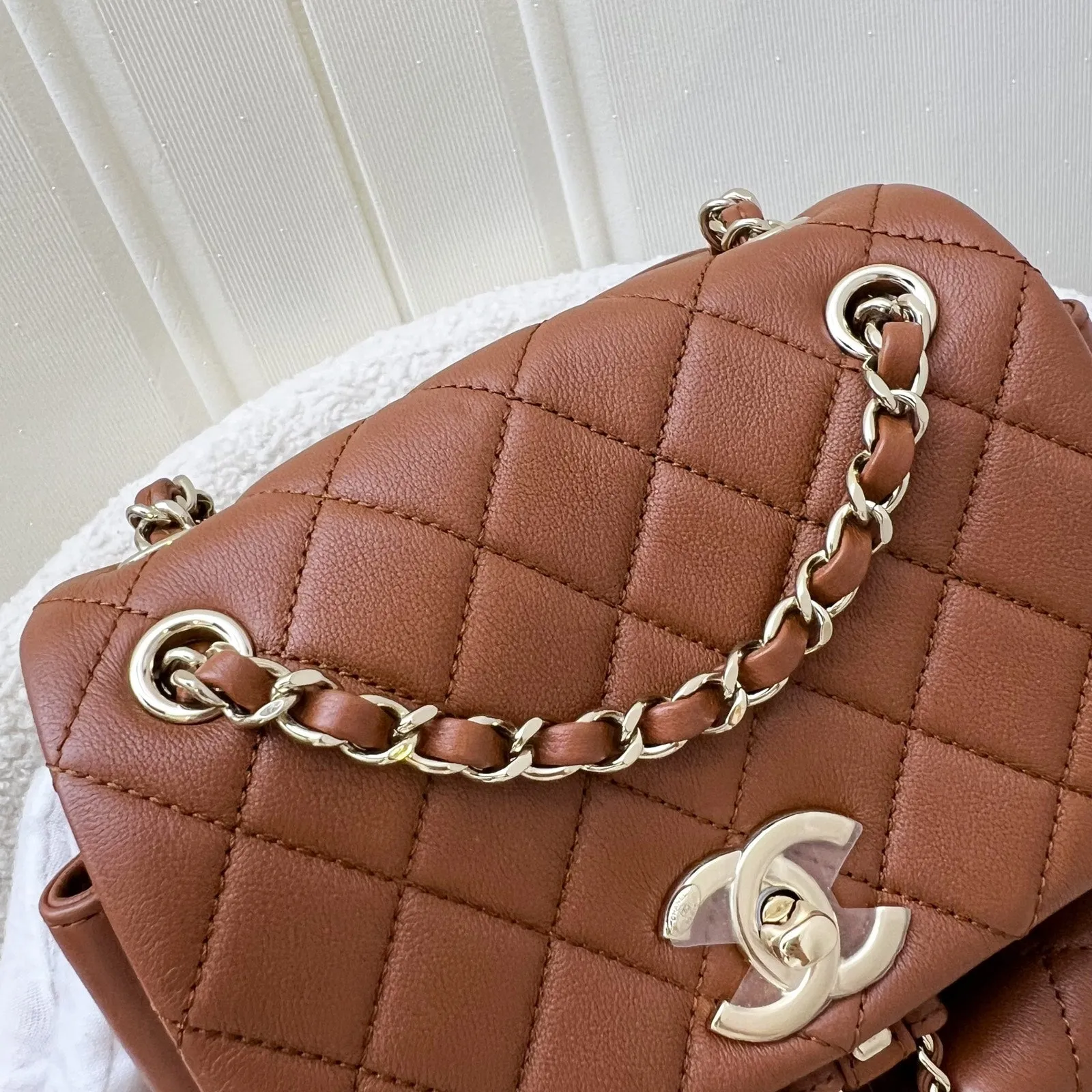 Chanel Medium Triple Backpack in 23A Cognac Brown Calfskin and LGHW (Model: AS3860)