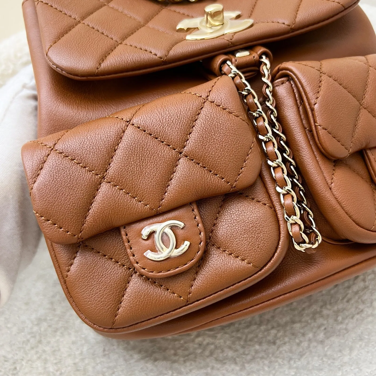 Chanel Medium Triple Backpack in 23A Cognac Brown Calfskin and LGHW (Model: AS3860)