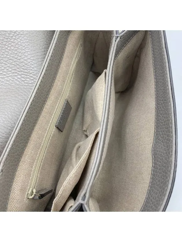 Interlocking top handle shoulder bag