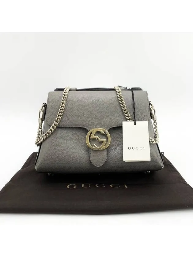 Interlocking top handle shoulder bag