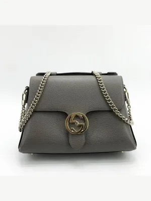 Interlocking top handle shoulder bag