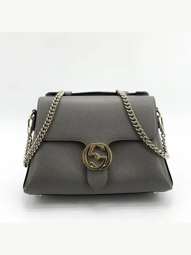 Interlocking top handle shoulder bag